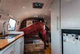 With no prior experience, the couple turned to online research—particularly Airforums.com—to look up answers to questions that arose during the renovation process. The 190-square-foot Airstream now boasts a stove, dining area, and cozy bedroom, which includes hidden storage.