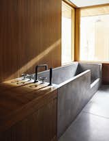 Bath Room, Wood Counter, Concrete Floor, and Drop In Tub  Search “bathsinks--drop-in” from A Curved House in Ontario Bends 100 Degrees for Forest Views