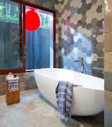 Bath Room, Concrete Floor, Soaking Tub, Freestanding Tub, Mosaic Tile Wall, and Open Shower  Photo 11 of 32 in Home by Trevor Young from Check Out These Pro Tips For Designing Kitchens and Bathrooms