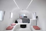 Bedroom, Bed, Ceiling Lighting, and Bench  Photo 6 of 9 in A Bold Airstream Hotel Tops a Melbourne Parking Garage