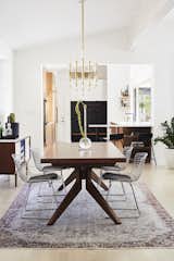 Dining, Stools, Table, Light Hardwood, Chair, Bar, Rug, Pendant, and Storage  Dining Light Hardwood Chair Table Bar Rug Photos from Midcentury Mashup: A 1950s Ranch House in Chicago Gets a Palm Springs–Style Butterfly Roof