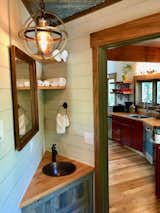 Bath Room, Wood Counter, and Medium Hardwood Floor  Photo 5 of 7 in Montana Treehouse Retreat by Dwell