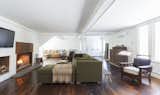 Multiple seating areas and creekside views in the Floating Farmhouse Great Room are enhanced by a massive wood-burning fireplace, 52" flat screen TV, and the waterfall's cascading rhythm as it fills the grand space.