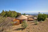 The customized yurt, attached hut, and porch are perched atop Refugio Mountain for stunning views.