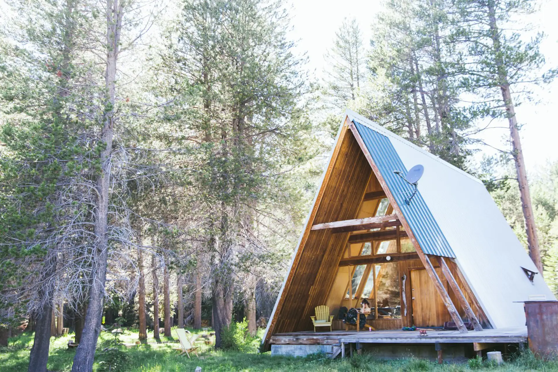 Perched at an elevation of 7,000 feet, this modern A-frame awaits in a remote location in California's Sierra National Forest. Fourteen miles above Bass Lake on the Sierra Vista Scenic Byway, this property is surrounded by meadows, secret swimming holes, and miles and miles of undiscovered hiking trails for a private Yosemite experience.