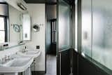 Bath Room, Wall Lighting, Pedestal Sink, and Dark Hardwood Floor  Photo 4 of 8 in The Robey by Dwell
