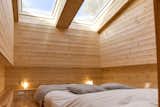 Bedroom, Medium Hardwood Floor, Accent Lighting, and Bed  Photo 3 of 6 in Côte d'Azur Cave House by Dwell