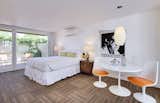 Bedroom, Table Lighting, Pendant Lighting, Bed, Night Stands, and Carpet Floor  Photo 6 of 6 in Del Marcos Hotel by Dwell