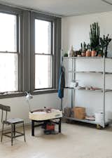 Office, Painted Wood, Chair, Shelves, and Craft Room In one corner of the studio, Spellman has an area dedicated to ceramics, as pictured above.  Office Shelves Craft Room Photos from This Stunning Studio in Rhode Island Is a Creative’s Dream