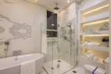 Bath Room, Marble Counter, Corner Shower, Freestanding Tub, Enclosed Shower, Recessed Lighting, Two Piece Toilet, Accent Lighting, and Marble Wall Classtone Estatuario  Photo 14 of 14 in How to Choose the Right Material For Every Surface of Your Home