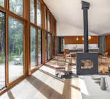 Large south-facing windows by Loewen and a high-efficiency Rais X wood-burning stove help to reduce energy demands.