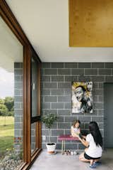 “God Save Dali,” by the artist BNS, hangs above a bench in a corner.  Photo 4 of 8 in Two Designers Create a Small but Luxe Catskills Retreat for About $285 Per Square Foot