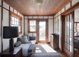 Living, End Tables, Rug, Sofa, Table, Ceiling, Lamps, and Medium Hardwood  Living Medium Hardwood Table Lamps Ceiling Photos from This Eclectic Beach Bungalow on Fire Island Was Saved After Sandy