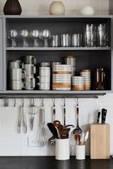 The kitchen cabinets, designed by Taku and built by Osamu Hironaga, hold dishes from Taku’s Hasami porcelain line, which is produced in Nagasaki.