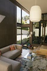 A sunken playroom in the site-built section of the house is wrapped in TK