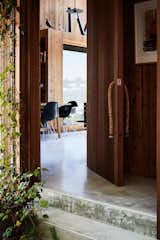 Doors, Exterior, Wood, and Swing Door Type The rope door pulls are Rich’s creation.  Search “rope-bracelet.html” from This New Zealand Architect Created a House That Looks Like a Tiny Village