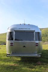 Exterior, Curved RoofLine, Airstream Building Type, Metal Roof Material, and Metal Siding Material The Globetrotter's aluminum shell catches the evening light. Power stabilizer jacks, an optional power awning, and a window awning package with Sunbrella fabrics help make it a true vehicle of leisure and adventure.  Photo 16 of 17 in Bodega Bay or Bust: Taking the Airstream Globetrotter to Northern California’s Coastal Gem