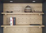 Adjustable pegboards help lawyer Dan Franklin manage his compact apartment in downtown Manhattan.