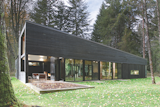Architect Robert Hutchinson suggested finishing the Western Red Cedar siding of this home with a black semi-transparent stain, and the homeowners were originally skeptical. But they ended up loving it.