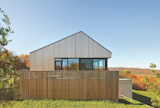 Exterior, House Building Type, Wood Siding Material, and Saltbox RoofLine An eco-friendly building material, Western Red Cedar was a suitably environmentally conscious material for the home.  Photo 7 of 16 in 5 Stunning Uses of Western Red Cedar