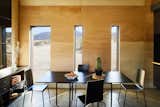 Dining Room, Concrete Floor, Storage, Table, and Chair The dining area features a Snaregade Table by Norm Architects for Menu.  IKEA MARTIN Chair from These Tiny, Off-the-Grid Cabins Near Joshua Tree Look Totally Apocalypse-Proof