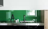 Kitchen, Colorful Cabinet, Cooktops, Undermount Sink, Glass Tile Backsplashe, and Metal Counter  Photos from Drift House