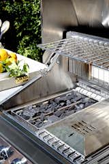 Outdoor Chef Ludo loaded up the grill’s smoker and charcoal tray with briquettes to add the flavors of a traditional barbecue. 