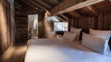 Bedroom, Light Hardwood Floor, Bed, and Track Lighting  Photo 8 of 12 in Le Chalet Zannier by Dwell