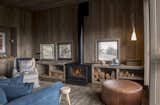 Living Room, Wood Burning Fireplace, Floor Lighting, Medium Hardwood Floor, Pendant Lighting, Rug Floor, Chair, and Sofa  Photo 3 of 11 in Awasi Patagonia by Dwell