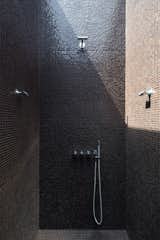 Bath Room, Mosaic Tile Wall, Open Shower, and Ceramic Tile Floor  Photo 7 of 12 in art by Deena Deutsch from A Major Restoration Updated This Midcentury Landmark in Belgium