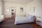 Bedroom, Bed, Medium Hardwood Floor, Night Stands, Rug Floor, and Table Lighting  Photo 2 of 15 in The Rose Hotel by Dwell