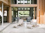 Thrown open, the folding doors allow the interiors to spill outside.  Photo 10 of 10 in New York Architect John Berg Invites Us Into His Indoor/Outdoor Hamptons Home