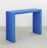 A blue gradient console from Facture Studio, made of layer of glossy resin.