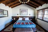 Bedroom, Wall Lighting, Bench, Night Stands, Pendant Lighting, Bed, and Rug Floor  Photo 1 of 9 in Pioneertown Motel by Dwell
