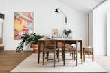 Dining Room, Table, Rug Floor, Light Hardwood Floor, Chair, and Wall Lighting  Photos from The Lisboans