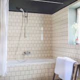 Bath Room and Ceramic Tile Wall  Photo 9 of 12 in Le Barn by Dwell