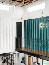 "One of the great surprises is the acoustic environment," Simmons says. "These are all hard surfaces and you get a bit of reverberation, but the corrugated walls help to disburse sound, so you don’t really get an echo. It actually has a kind of warm sound."