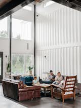 The Fosters unwind in the soaring, 960-square-foot great room. The family wanted plenty of space for hosting friends and events, as well as lots of bedrooms so they can rent the house to groups on Airbnb if they like.  Photo 2 of 13 in A Colorado Firefighter Built His Own Shipping Container Home, and Found a New Calling Along the Way