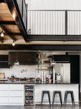 Kitchen, Pendant Lighting, Refrigerator, and Concrete Floor The kitchen cabinets are from IKEA and the full refrigerator is by LG.  John Rose’s Saves from A Colorado Firefighter Built His Own Shipping Container Home, and Found a New Calling Along the Way