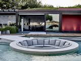 Decades after Italian architect Ferdinando Fagnola codesigned a series of Brutalist villas on the Sardinian coast in the mid-1970s, he returned to compound with a group of younger architects to transform some of the structures into a home for new owners. The renovation by Turin-based studio PAT. includes a swanky mid-pool conversation pit—one of many maximalist ’70s features.&nbsp;
