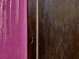 Doors and Swing Door Type All across the property, blocks of jewel-toned color meet raw materials, like a hot pink concrete wall next to a Cor-Ten steel door with a rebar handle.  Photos from An Architect Unites Three Brutalist Villas He Designed on Sardinia in the 1970s