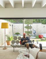 Living Room, Chair, Carpet Floor, Sofa, Coffee Tables, and Floor Lighting  Photo 18 of 25 in The Ellison House by Dwell from Pop Art, Street Art, and Space-Age Furniture Collide at a Painter’s Midcentury Ranch Home in Florida