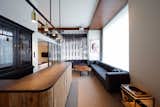 Living Room, Sofa, Bar, Coffee Tables, Pendant Lighting, and Carpet Floor  Photo 3 of 16 in Trunk Hotel by Dwell