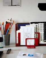 A sketch Nicholas drew of his office at The New Yorker stands in front of an illustration he made of their building.  Photo 10 of 17 in Two Magazine Creatives Fit Graphic Art and Vintage Furniture in a Brooklyn Apartment