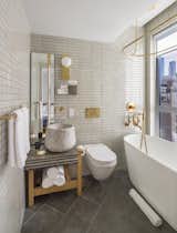 Bath Room, Freestanding Tub, Vessel Sink, Wall Lighting, and One Piece Toilet  Photo 10 of 10 in MADE Hotel by Dwell
