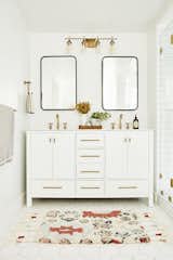 Bath Room, Marble Counter, Porcelain Tile Floor, and Wall Lighting  Photos from Bathrooms We Love: Beauty and Home Vlogger Kristin Johns Showcases Her Glistening Bathroom in L.A.