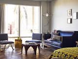 Living Room, End Tables, Dark Hardwood Floor, Sofa, Coffee Tables, Chair, and Pendant Lighting  Photo 1 of 9 in The LINE DC by Dwell