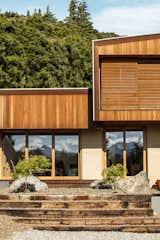 Kanuka Valley House exterior with sliding cedar screens