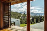 One of the home’s many sliding cedar shutters opens to reveal a spectacular vista. 
