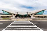 An abandoned airport terminal at New York’s John F. Kennedy International Airport was reborn as the TWA Hotel, a stylish stay that harkens on the romance of flying when it was still a novelty. Paying homage to the original architecture of the 1962 building designed by architect Eero Saarinen, JFK's only on-airport hotel is complete with midcentury modern guest rooms, a 10,000-square-foot rooftop deck with pool, and immersive experiences.